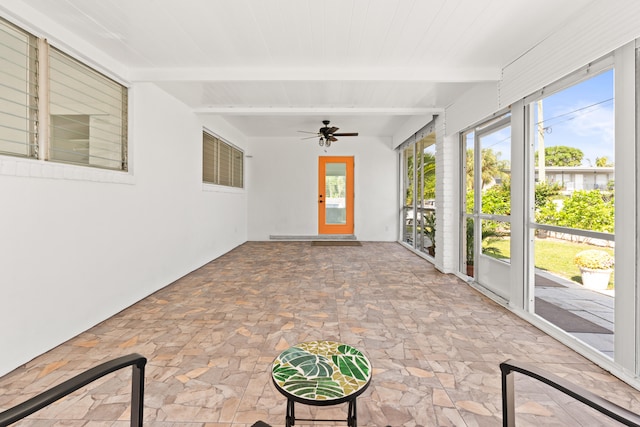 1428 N M St, Lake Worth Beach, FL 33460 - unfurnished sunroom featuring beam ceiling