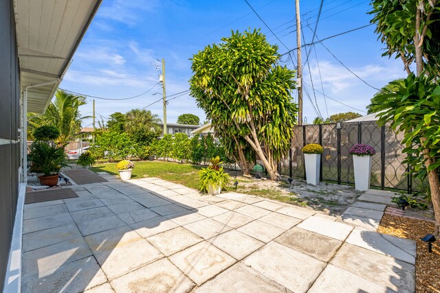 1428 N M St, Lake Worth Beach, FL 33460 - fenced backyard with a patio
