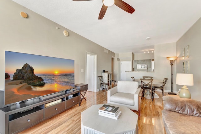 550 Okeechobee Blvd Unit 821, West Palm Beach, FL 33401 - living room featuring ceiling fan, light wood finished floors, and baseboards