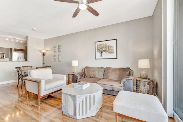 550 Okeechobee Blvd Unit 821, West Palm Beach, FL 33401 - living room with ceiling fan, light wood-style floors, and baseboards