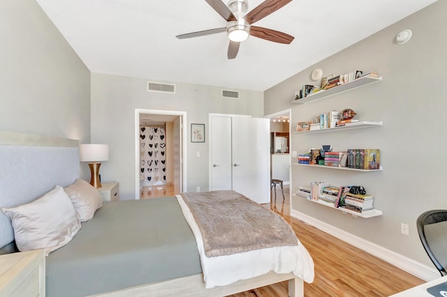 550 Okeechobee Blvd Unit 821, West Palm Beach, FL 33401 - bedroom featuring light wood finished floors, baseboards, and a ceiling fan