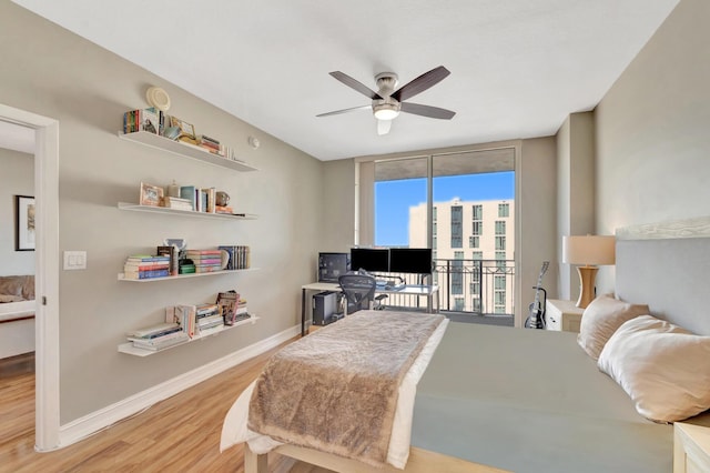 550 Okeechobee Blvd Unit 821, West Palm Beach, FL 33401 - bedroom with expansive windows, wood finished floors, access to exterior, baseboards, and a ceiling fan