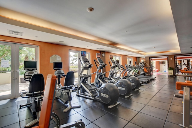 550 Okeechobee Blvd Unit 821, West Palm Beach, FL 33401 - exercise room with healthy amount of natural light, french doors, and a raised ceiling