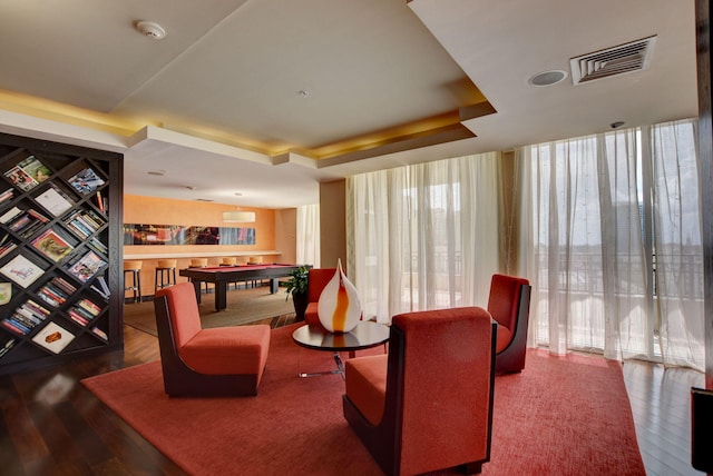 550 Okeechobee Blvd Unit 821, West Palm Beach, FL 33401 - living area with a tray ceiling, pool table, wood finished floors, and floor to ceiling windows