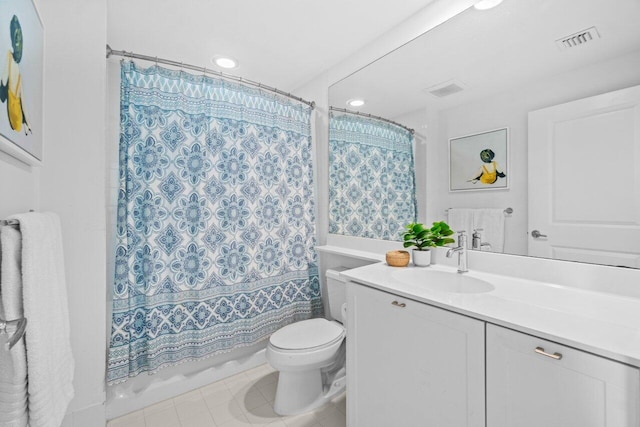 225 NE 1st St Unit 415, Delray Beach, FL 33444 - bathroom featuring vanity, toilet, tile patterned flooring, and recessed lighting