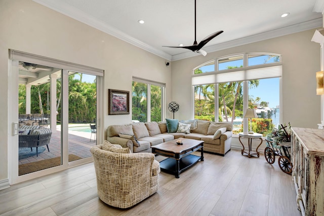 506 Corsair Dr, North Palm Beach, FL 33408 - living room featuring ceiling fan, plenty of natural light, recessed lighting, ornamental molding, and light wood-type flooring