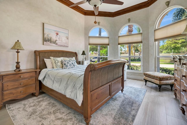 506 Corsair Dr, North Palm Beach, FL 33408 - bedroom featuring crown molding, light wood-style floors, and a ceiling fan