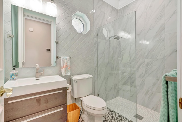 506 Corsair Dr, North Palm Beach, FL 33408 - bathroom featuring a marble finish shower, vanity, tile walls, and toilet