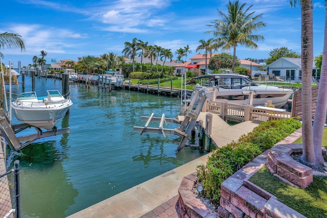 506 Corsair Dr, North Palm Beach, FL 33408 - dock area featuring boat lift and a water view