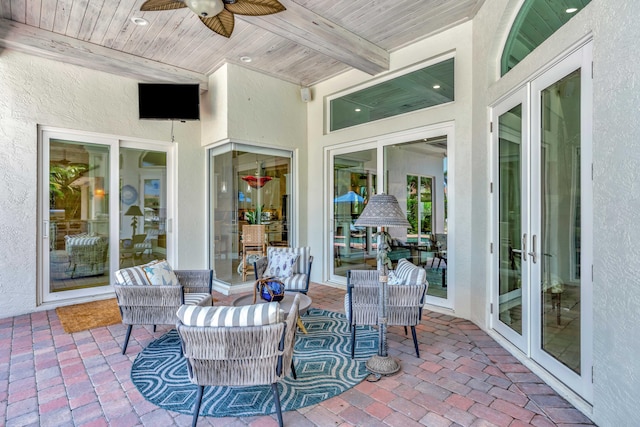 506 Corsair Dr, North Palm Beach, FL 33408 - sunroom / solarium featuring ceiling fan, french doors, and beamed ceiling
