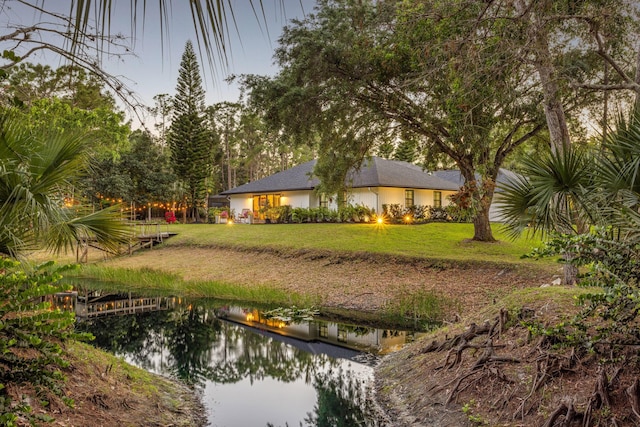 9544 Mockingbird Trl, Jupiter, FL 33478 - view of grassy yard with a water view