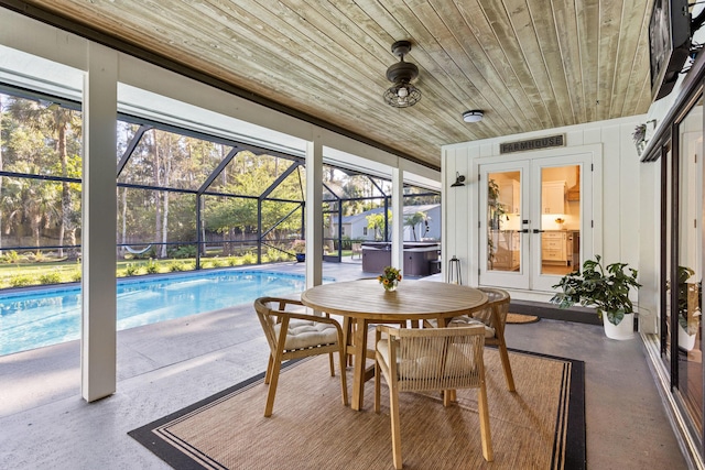 9544 Mockingbird Trl, Jupiter, FL 33478 - sunroom / solarium with a hot tub, french doors, and a pool