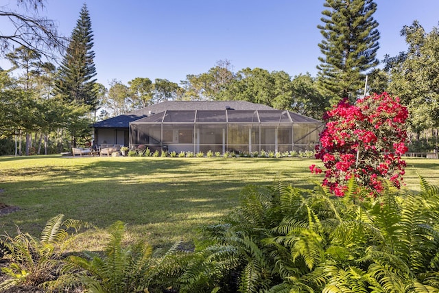 9544 Mockingbird Trl, Jupiter, FL 33478 - view of green lawn featuring a lanai