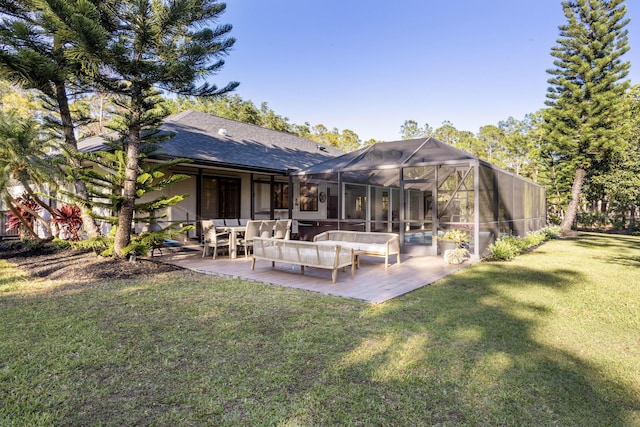 9544 Mockingbird Trl, Jupiter, FL 33478 - back of property featuring an outdoor living space, a patio, a yard, glass enclosure, and roof with shingles