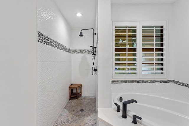 9544 Mockingbird Trl, Jupiter, FL 33478 - bathroom featuring tiled shower and a garden tub