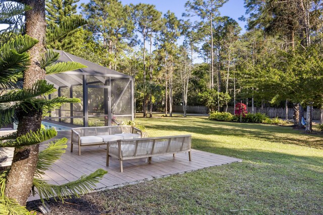 9544 Mockingbird Trl, Jupiter, FL 33478 - view of yard with a deck, glass enclosure, and outdoor lounge area