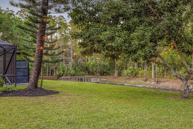 9544 Mockingbird Trl, Jupiter, FL 33478 - view of green lawn featuring glass enclosure