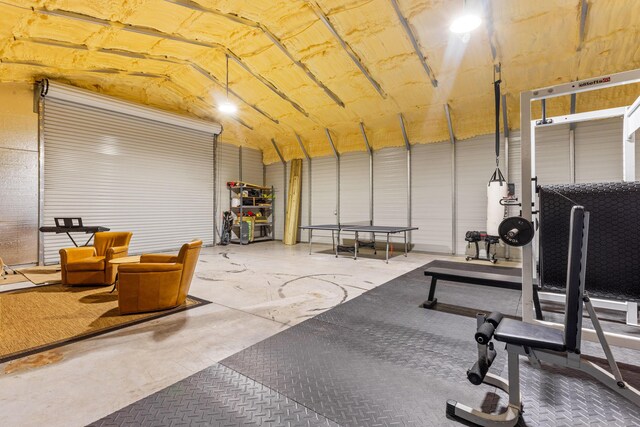 9544 Mockingbird Trl, Jupiter, FL 33478 - exercise area featuring a garage, lofted ceiling, and gas water heater