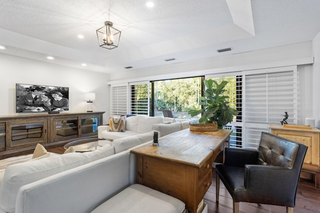 9544 Mockingbird Trl, Jupiter, FL 33478 - living room with a raised ceiling, wood finished floors, recessed lighting, and a textured ceiling
