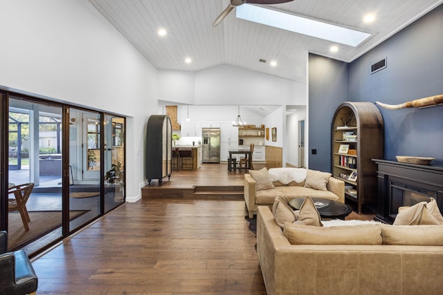 9544 Mockingbird Trl, Jupiter, FL 33478 - living room with dark wood finished floors, a skylight, high vaulted ceiling, a ceiling fan, and recessed lighting