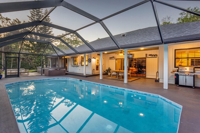 9544 Mockingbird Trl, Jupiter, FL 33478 - outdoor pool featuring a hot tub, a patio, glass enclosure, and grilling area