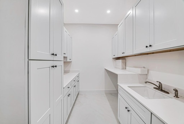 2929 Lorene Dr, Palm Springs, FL 33461 - laundry room with a sink, recessed lighting, and baseboards