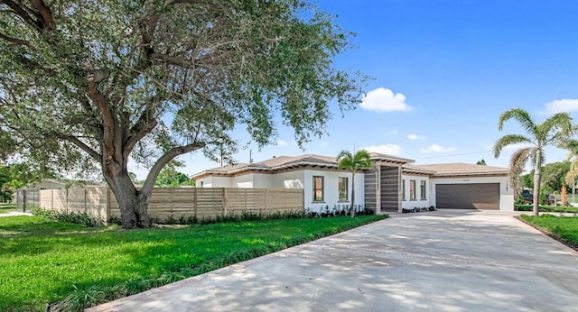 2929 Lorene Dr, Palm Springs, FL 33461 - view of front of house with concrete driveway, an attached garage, and stucco siding