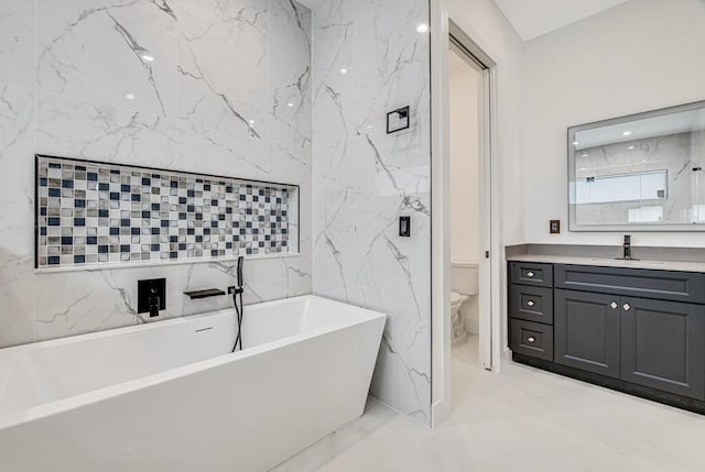 2929 Lorene Dr, Palm Springs, FL 33461 - bathroom with toilet, a freestanding bath, vanity, and tile walls