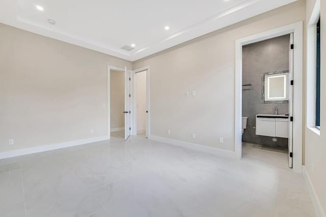 2929 Lorene Dr, Palm Springs, FL 33461 - unfurnished bedroom with recessed lighting, baseboards, light marble finish floors, ensuite bathroom, and a sink