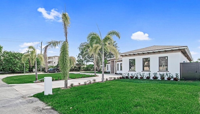 2929 Lorene Dr, Palm Springs, FL 33461 - view of front of house with a front yard and stucco siding