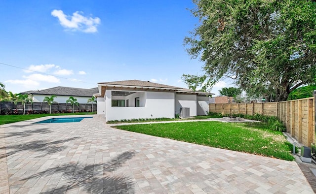 2929 Lorene Dr, Palm Springs, FL 33461 - back of house with stucco siding, a patio area, and cooling unit
