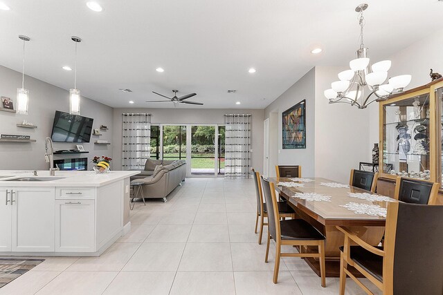 9319 Silver Shores Ln, Boynton Beach, FL 33473 - dining room featuring light tile patterned floors, recessed lighting, a chandelier, and ceiling fan
