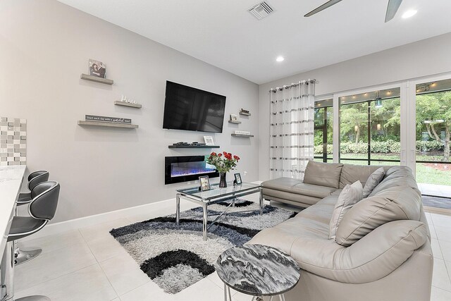 9319 Silver Shores Ln, Boynton Beach, FL 33473 - living area featuring tile patterned floors, ceiling fan, baseboards, and recessed lighting
