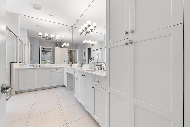 9319 Silver Shores Ln, Boynton Beach, FL 33473 - bathroom with a chandelier, tile patterned floors, vanity, and a shower with shower door