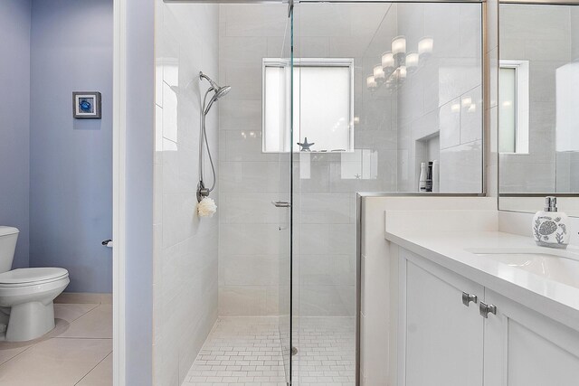9319 Silver Shores Ln, Boynton Beach, FL 33473 - bathroom with toilet, a shower stall, plenty of natural light, and vanity