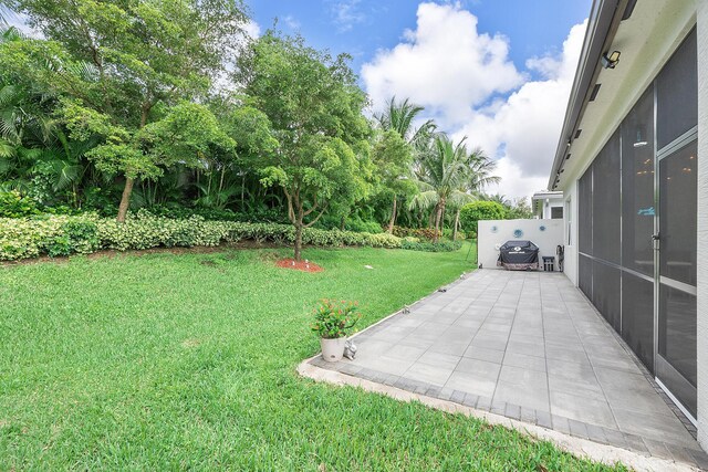 9319 Silver Shores Ln, Boynton Beach, FL 33473 - view of grassy yard with a patio area