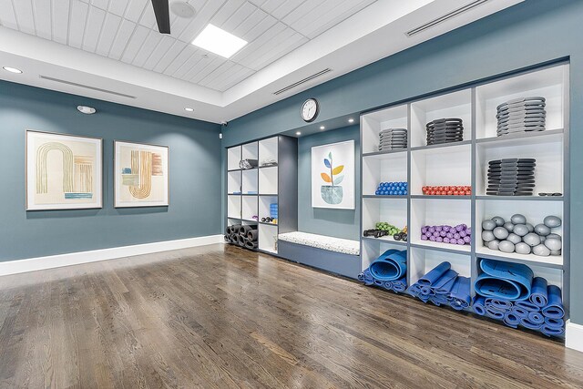9319 Silver Shores Ln, Boynton Beach, FL 33473 - workout area featuring wood finished floors, baseboards, a raised ceiling, ceiling fan, and recessed lighting