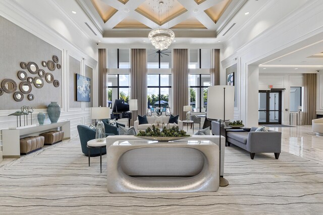 9319 Silver Shores Ln, Boynton Beach, FL 33473 - community lobby featuring a high ceiling, coffered ceiling, beamed ceiling, a decorative wall, and ornamental molding
