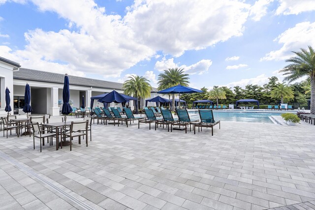 9319 Silver Shores Ln, Boynton Beach, FL 33473 - community pool featuring a patio area