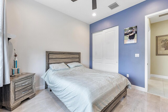 9319 Silver Shores Ln, Boynton Beach, FL 33473 - bedroom featuring baseboards, a closet, a ceiling fan, light tile patterned floors, and recessed lighting