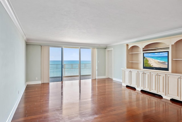 350 Beach Rd Unit 503, Tequesta, FL 33469 - unfurnished living room with ornamental molding, baseboards, wood finished floors, and built in shelves