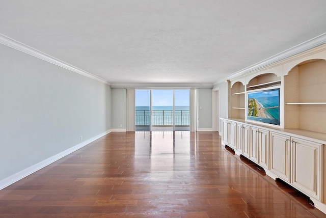 350 Beach Rd Unit 503, Tequesta, FL 33469 - empty room with ornamental molding, dark wood-style flooring, baseboards, and built in shelves