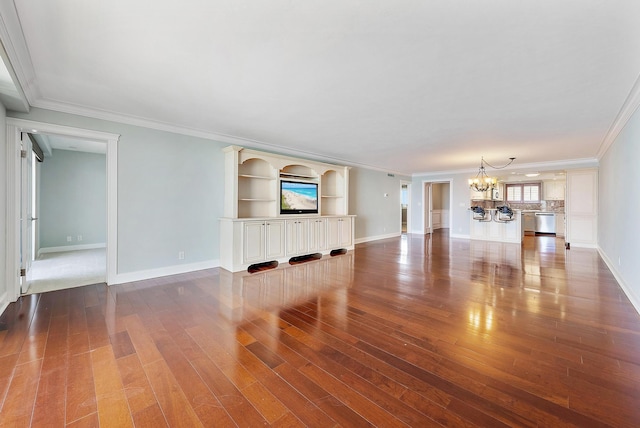 350 Beach Rd Unit 503, Tequesta, FL 33469 - unfurnished living room featuring a chandelier, wood finished floors, ornamental molding, and baseboards