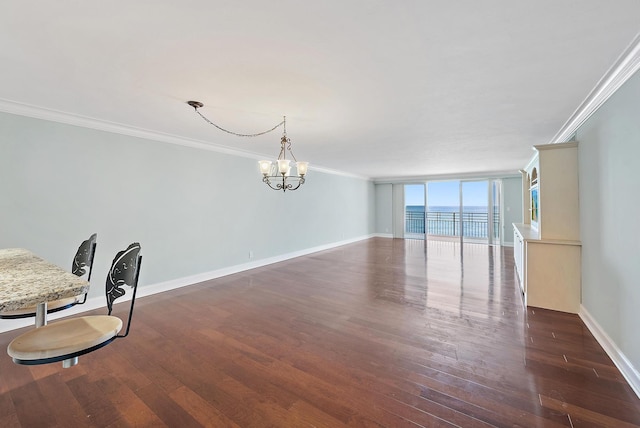 350 Beach Rd Unit 503, Tequesta, FL 33469 - unfurnished dining area with crown molding, dark wood finished floors, a chandelier, and baseboards