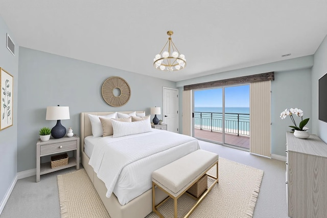 350 Beach Rd Unit 503, Tequesta, FL 33469 - bedroom with light carpet, access to outside, and baseboards