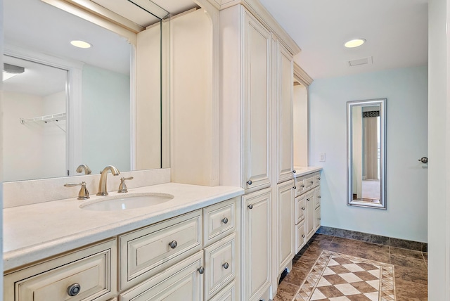 350 Beach Rd Unit 503, Tequesta, FL 33469 - bathroom featuring vanity, baseboards, recessed lighting, and a walk in closet
