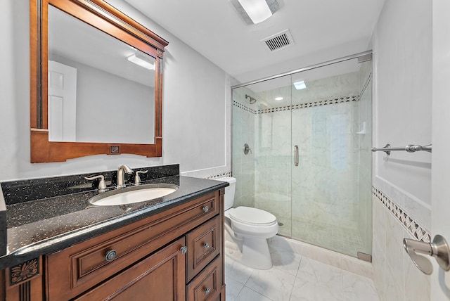 350 Beach Rd Unit 503, Tequesta, FL 33469 - bathroom featuring toilet, vanity, a stall shower, and marble finish floors