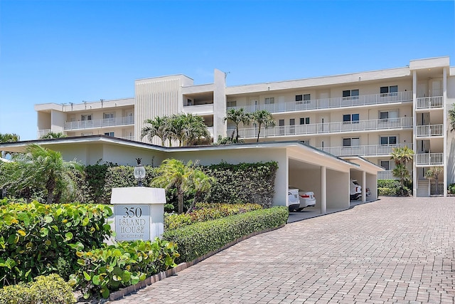 350 Beach Rd Unit 503, Tequesta, FL 33469 - view of apartment building / complex with covered parking