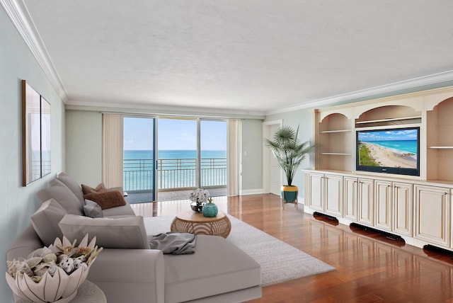 350 Beach Rd Unit 503, Tequesta, FL 33469 - living room with crown molding, wood finished floors, and baseboards