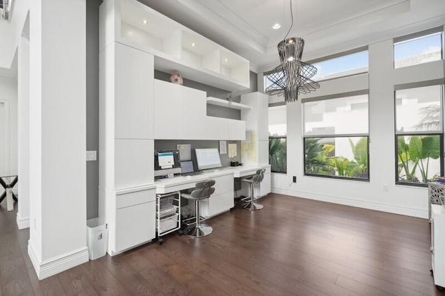 office with built in desk, dark wood finished floors, a chandelier, baseboards, and recessed lighting